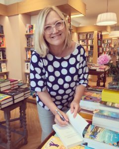 Helena signing copies of The Island Affair, a book about love, family, and friendship