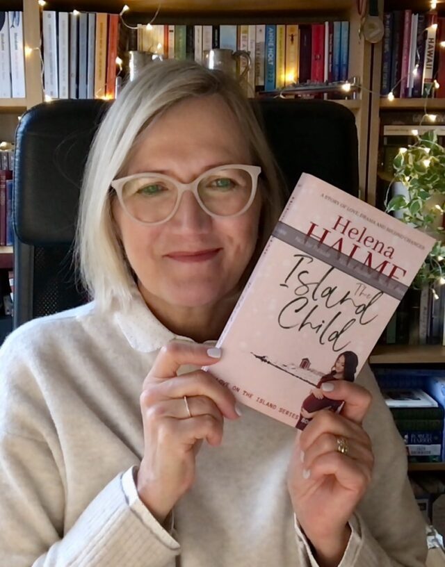 Holding a paperback proof copy of The Island Child